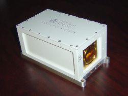 Figure 8: Photo of the Ku-band solid-state power amplifier (image credit: NASA)> Digital receiver and signal processor subsystem: This subsystem is responsible for implementing digital I&Q detection, match filtering (i.e. pulse compression), spectral and/or pulse-pair processing and data reduction through coherent and/or non-coherent averaging. The subsystem is using FPGAs (Field Programmable Gate Arrays) and low power consumption processors. This will provide the most compact solution and not require pressurization. To reduce risk, the system is network based so that the data can be easily ingested by a PC-based system where further processing algorithms may be applied. As the algorithms are tested and validated, they can be transferred to the FPGA-based processors with minimum impact. To reduce risks, the critical FPGA-based algorithms are being tested within a development platform from which the final stand alone printed circuit boards will be designed and fabricated. The migration to radiation-hardened FPGA technology is also being studied. Another novel feature of the FPGA-based digital receiver is that each IF channel will support up to eight independent sub-channels. With more than 90 dB of rejection and a 1.5 filter shape factor, HIWRAP will be able to utilize frequency diversity to improve its independent sampling rate and implement an advance phase correction scheme for unfolding its Doppler measurements. The primary digital receiver characteristics are: - Two IF channels per board - Eight independent sub channels per IF channel - 80 MHz max IF (Intermediate Frequency) - 500 kHz min frequency - 1 Hz resolution - 500 kHz to 20 MHz bandwidth per subchannel - 40 MHz aggregated bandwidth per IF channel - Greater than 80 dB SNR - 14 bit A/D resolution - Matched filter supports up to 30 dB pulse compression gain per subchannel - Supports up to 1000 range gates. Figure 9: HIWRAP scanner assembly enclosures (image credit: NASA) The HIWRAP data system utilizes a (CPCI (Compact PCI) bus based SBC (Single Board Computer) to run the radar control program and to capture the raw or processed data from the digital receiver through a high-speed fiber optic/Gbit Ethernet link. The scanner is a DC powered, brushless, COTS (Commercial off-the-Shelf) unit with a superior mechanical design and flexible configuration. It communicates with the host computer system through either RS232 or Ethernet. HIWRAP also utilizes a dedicated high-speed navigation system to provide precise platform position/altitude information. Radar status information, scanner position and navigation data will be collected and saved by the host computer along with radar data. Flight testing: The long term HIWRAP plans are to fly long duration flights over hurricanes with the NASA Global Hawk based at NASA Dryden. Because of Global Hawk availability and that HIWRAP will have a number of new technologies to test, the WB-57 aircraft based at NASA Johnson will be used. The WB-57 provides an excellent simulator for the Global Hawk operating environment since both planes fly at similar altitudes. The HIWRAP instrument is also compatible to be installed into the ER-2 aircraft of NASA (Ref. 5). • Initial demonstration and validation flights of the HIWRAP instrument were conducted on the WB-57 aircraft in March 2010. This was done due to limited Global Hawk availability and the fact that HIWRAP had a number of new technologies to test. Figure 10: The HIWRAP instrument mounted on a WB-57 aircraft pallet of 1.85 m in length (image credit: NASA) • After the WB57 test flights, efforts were switched to integrate HIWRAP on Global Hawk so that it could be ready for the GRIP science flight mission. The initial installation was started in July 2010. During the GRIP mission, Global Hawk carried out five science flights, including Hurricane Frank on the Pacific coast, Hurricane Earl on the Atlantic east coast, Caribbean Tropical Disturbance, Hurricane Karl in the Gulf of Mexico and Hurricane Matthew in Central America. HIWRAP performed well during these 15 to 25 hour long science flights. Figure 12 is a satellite image of Hurricane Matthew and showing the Global Hawk flight track during the flight on September 25, 2010. Figure 13 shows the uncalibrated backscattering power measured by the Ka inner beam and Ku inner beam channels (20 µs/1 MHz linear chirp) through four azimuth scan cycles. Both images show the precipitation region at low altitude and cloud layer up high as well as surface return at 23 km slant range. The variation in the range of the surface return was due to the non-zero aircraft pitch angle. The Ka-band image also indicates strong attenuation from precipitation. As a result, the surface return was not seen by this frequency in these regions. Figure 11: The HIWRAP instrument mounted in Global Hawk radar chamber (image credit: NASA) Figure 12: Satellite image of Hurricane Matthew (September 25, 2010) and Global Hawk flight track (image credit: NASA) Figure 13: Preliminary images of uncalibrated backscattering power (a) Ka inner beam, (b) Ku inner beam. Both beams were operated with 20 µs/1 MHz linear chirp mode. Future plans: The HIWRAP system post-flight calibration and data processing are under the way. Meanwhile, HIWRAP will be configured in fixed nadir pointing mode and installed on the NASA ER-2. • The NASA GPM (Global Precipitation Mission) pre-launch ground validation flight mission, called MC3E (Midlatitude Continental Convective Cloud Experiment), will be held at the DOE (Department of Energy) ARM (Atmospheric Radiation Measurement) climate research facility in north-central Oklahoma during April-May 2011. • In addition, HIWRAP will fly on the Global Hawk in support of the NASA Venture Class mission HS3 (Hurricane and Severe Storm Sentinel) missions from year 2012 to 2014. 1) Gerald Heymsfield, James Carswell, Lihua Li, Dan Schaubert, Justin Creticos, Manuel Vega, Wayne Welch, “Status of the High-Altitude Imaging Wind and Rain Airborne Profiler (HIWRAP),” ESTC2008 (Earth Science Technology Conference 2008), June 24-26, 2008, College Park, MD, USA, URL: http://esto.nasa.gov/conferences/estc2008/papers/Heymsfield_Gerald_B5P2.pdf 2) Lihua Li, Gerald Heymsfield, James Carswell, Dan Schaubert, Justin Creticos, Manuel Vega, “High-Altitude Imaging Wind and Rain Airborne Radar (HIWRAP),” Proceedings of IGARSS 2008 (IEEE International Geoscience & Remote Sensing Symposium), Boston, MA, USA, July 6-11, 2008 3) Gerald Heymsfield, James Carswell, Lihua Li, Dan Schaubert, Justin Creticos, “Development of the High-Altitude Imaging Wind and Rain Airborne Profiler (HIWRAP),” NSTC2007 (NASA Science Technology Conference 2007), College Park, MD, USA, June 19-21, 2007, URL: http://esto.nasa.gov/conferences/nstc2007/papers/Carswell_James_B5P2_NSTC-07-0085.pdf 4) James R Carswell, Gerald Heymsfield, Lihua Li, Dan Schaubert, Justin Creticos, “A High Altitude Airborne Wind Mapping Radar,“ Proceedings of the 2008 IEEE Aerospace Conference, Big Sky, MT, USA, March 1-8, 2008 5) Lihua Li, Gerald Heymsfield, James Carswell, Dan Schaubert, Matthew McLinden, Manuel Vega, Martin Perrine, “Development of the NASA High-Altitude Imaging Wind and Rain Airborne Profiler,” 2011 IEEE Aerospace Conference, Big Sky, MT, USA, March 5-12, 2011 6) J. R. Carswell, “Final Report: A Revolutionary Wind and Rain Airborne Profiler for Unmanned Aircraft Vehicles”, NASA STTR Final Report, Contract No. NNG05CA96C, January 2006 The information compiled and edited in this article was provided by Herbert J. Kramer from his documentation of: "Observation of the Earth and Its Environment: Survey of Missions and Sensors" (Springer Verlag) as well as many other sources after the publication of the 4th edition in 2002. - Comments and corrections to this article are always welcome for further updates.